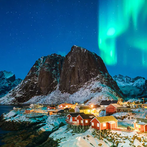 The Northern Lights over a town in the Norwegian Fjords